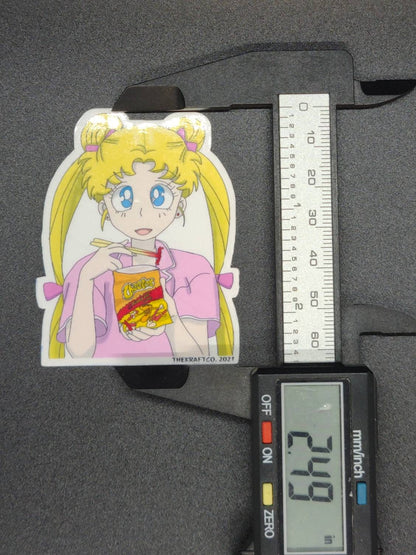 Sailor moon eating hot Cheetos with chopsticks laminated sticker.